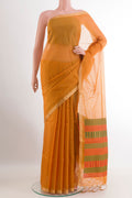 Mustard Blended Silk Cotton Saree with Checked design on the body and Zari Border.  displayed on a mannequin