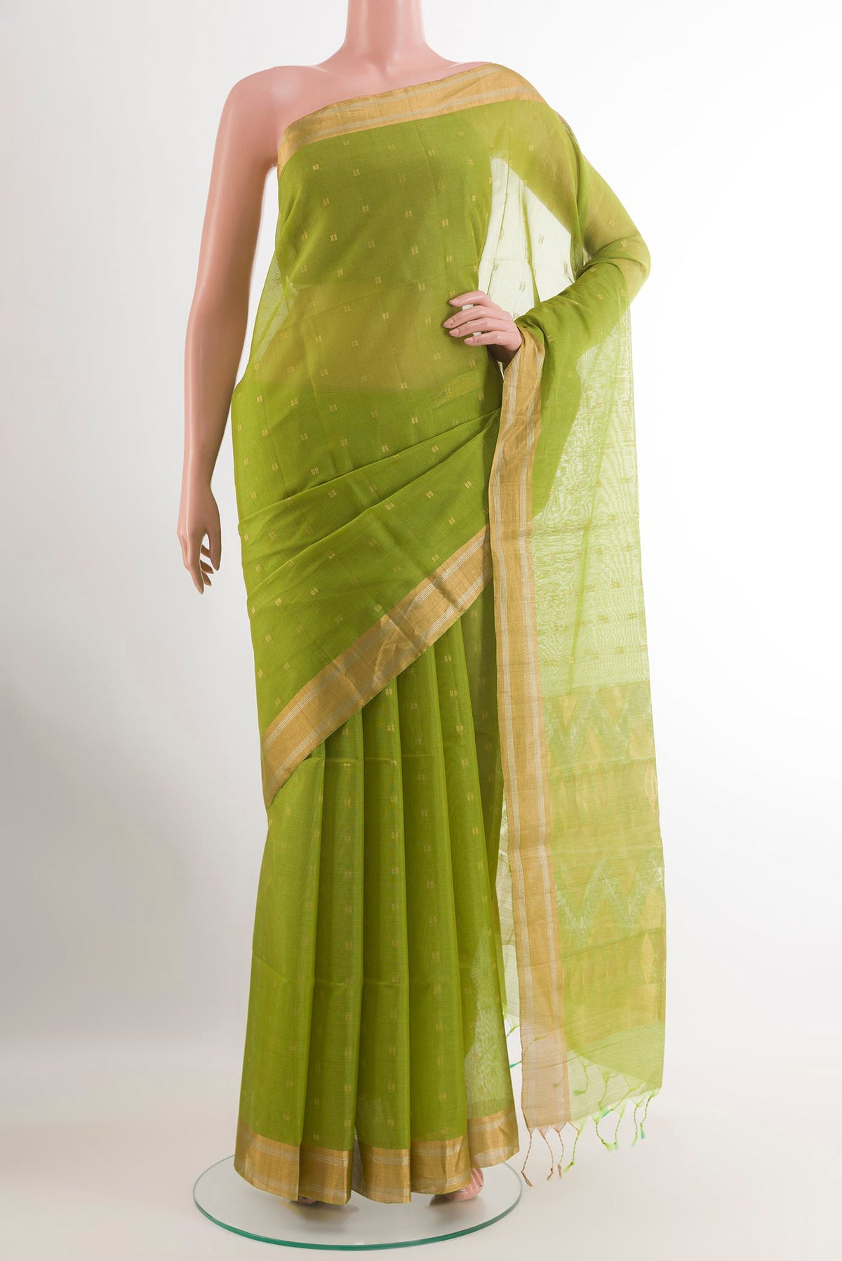 Green Blended Silk Cotton Saree with Zari Butta on the body and Zari Border.  displayed on a mannequin