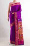 Purple Paithani Silk Saree with Zari Butta on the body and Zari Border.  displayed on a mannequin