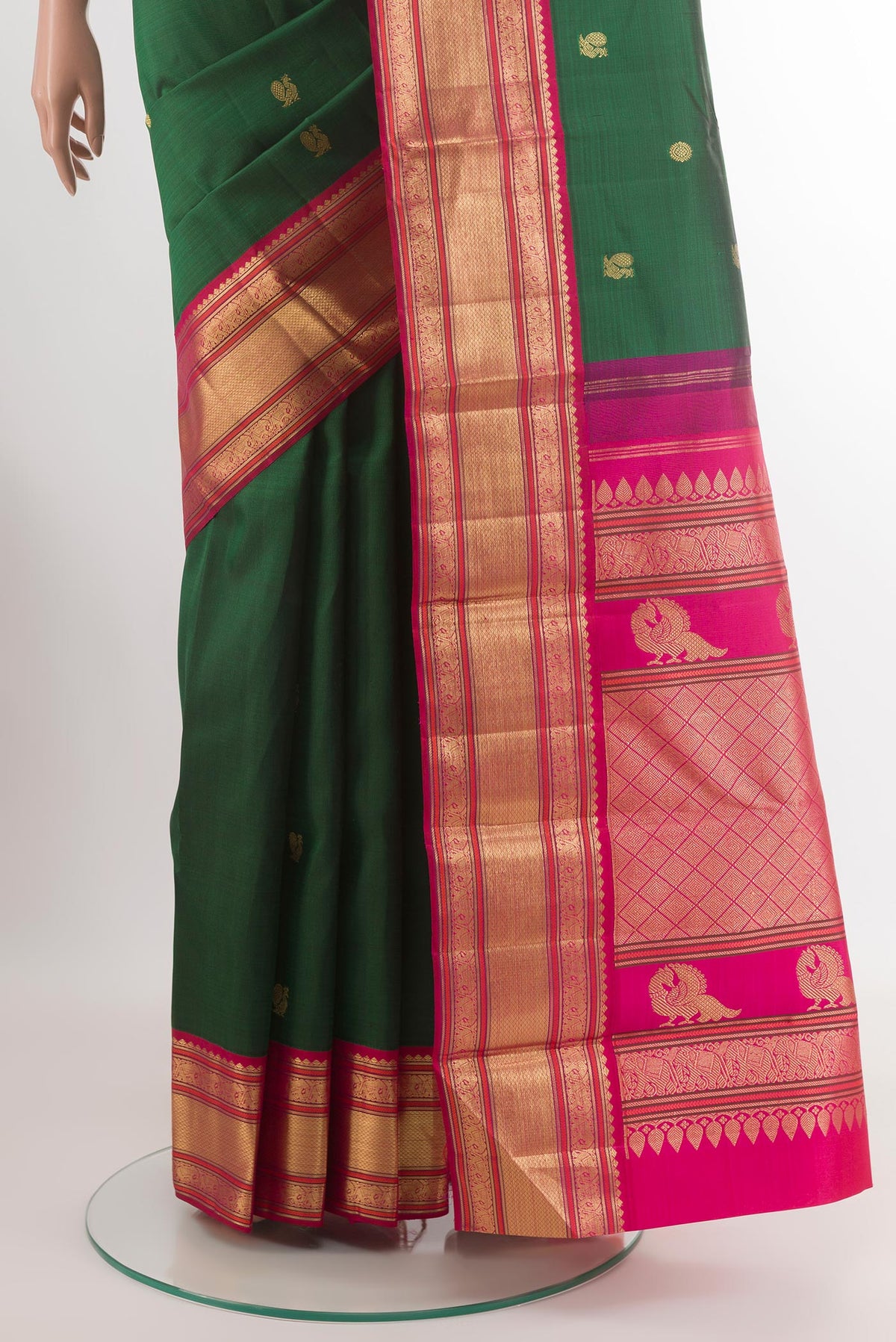 Pleats and pallu of Green Kanjivaram Silk Saree with Zari Butta on the body and Zari Border. 