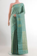 Blue Grey Kanchipuram Silk Saree with Zari Butta on the body and Zari Border.  displayed on a mannequin