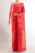 Orange Kanchipuram Silk Saree with Checked design on the body and Zari Border.  displayed on a mannequin