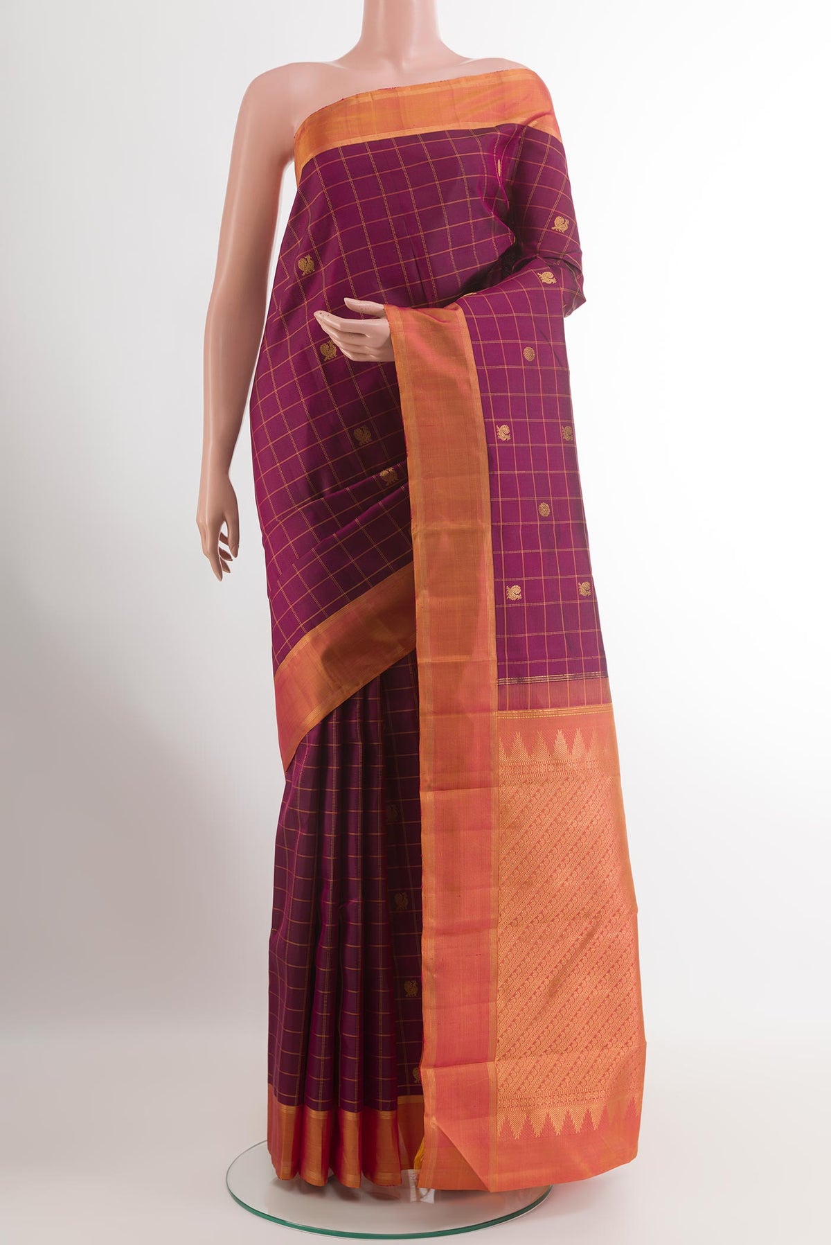 Purple Kanchipuram Silk Saree with Checked design on the body and Zari Border.  displayed on a mannequin