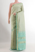 Mint Green Kanjivaram Silk Saree with Plain Body and Zari Border.  displayed on a mannequin