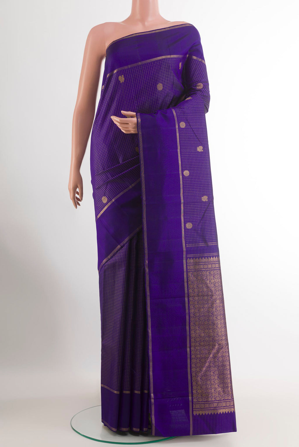 Dark Blue Kanchipuram Silk Saree with Checked design on the body and Zari Border.  displayed on a mannequin