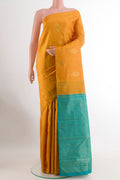 Yellow Kanchipuram Silk Saree with Zari Butta on the body and Without Border.  displayed on a mannequin