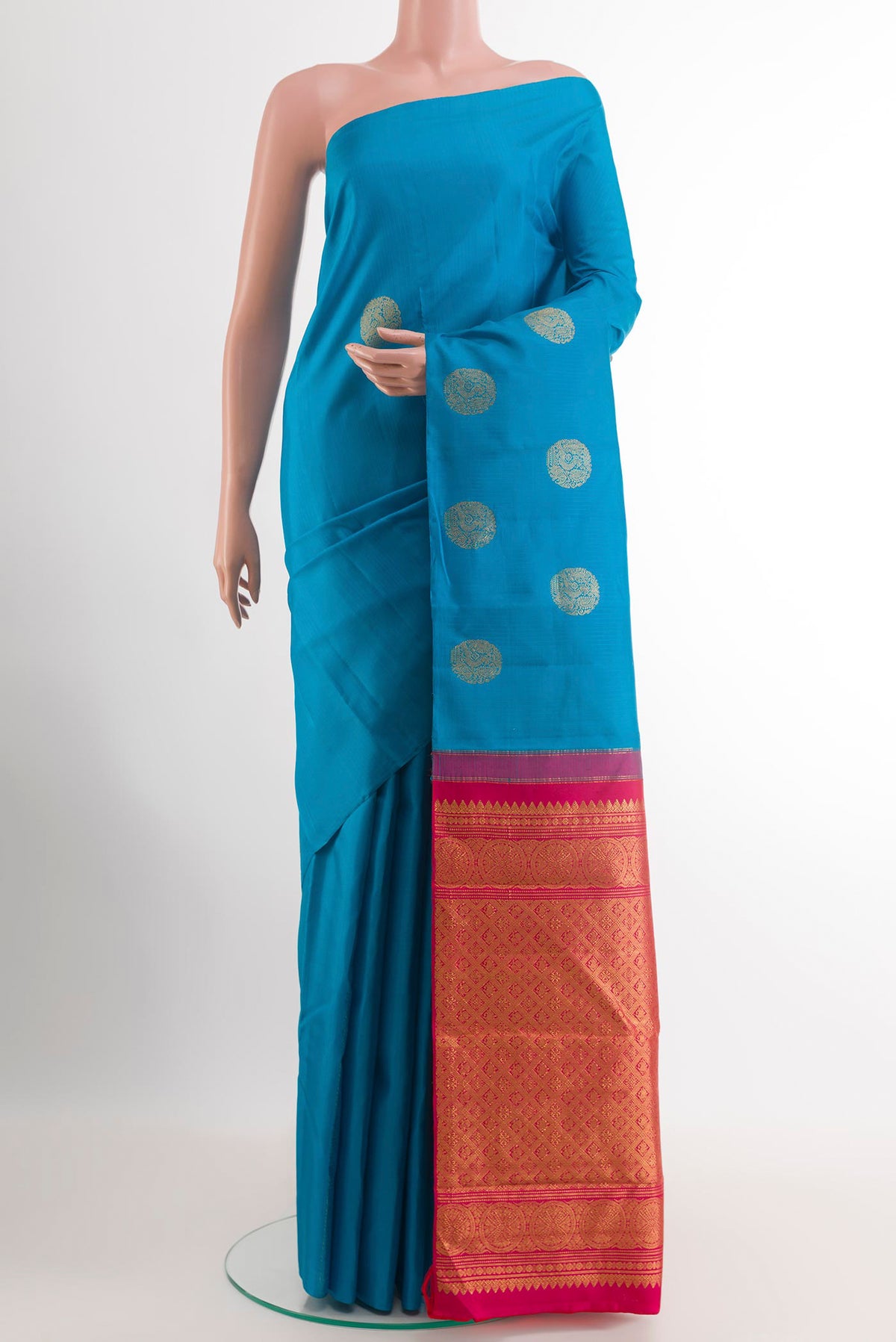 Blue Kanchipuram Silk Saree with Zari Butta on the body and Without Border.  displayed on a mannequin
