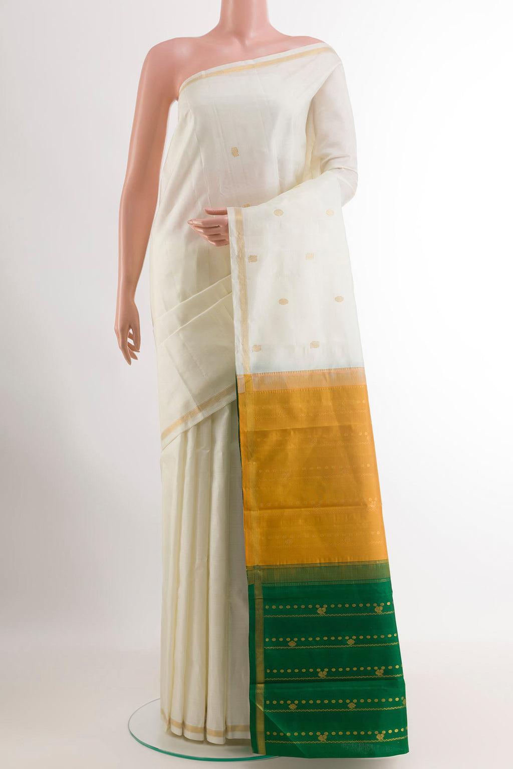 Off White Kanchipuram Silk Saree with Zari Butta on the body and Zari Border.  displayed on a mannequin