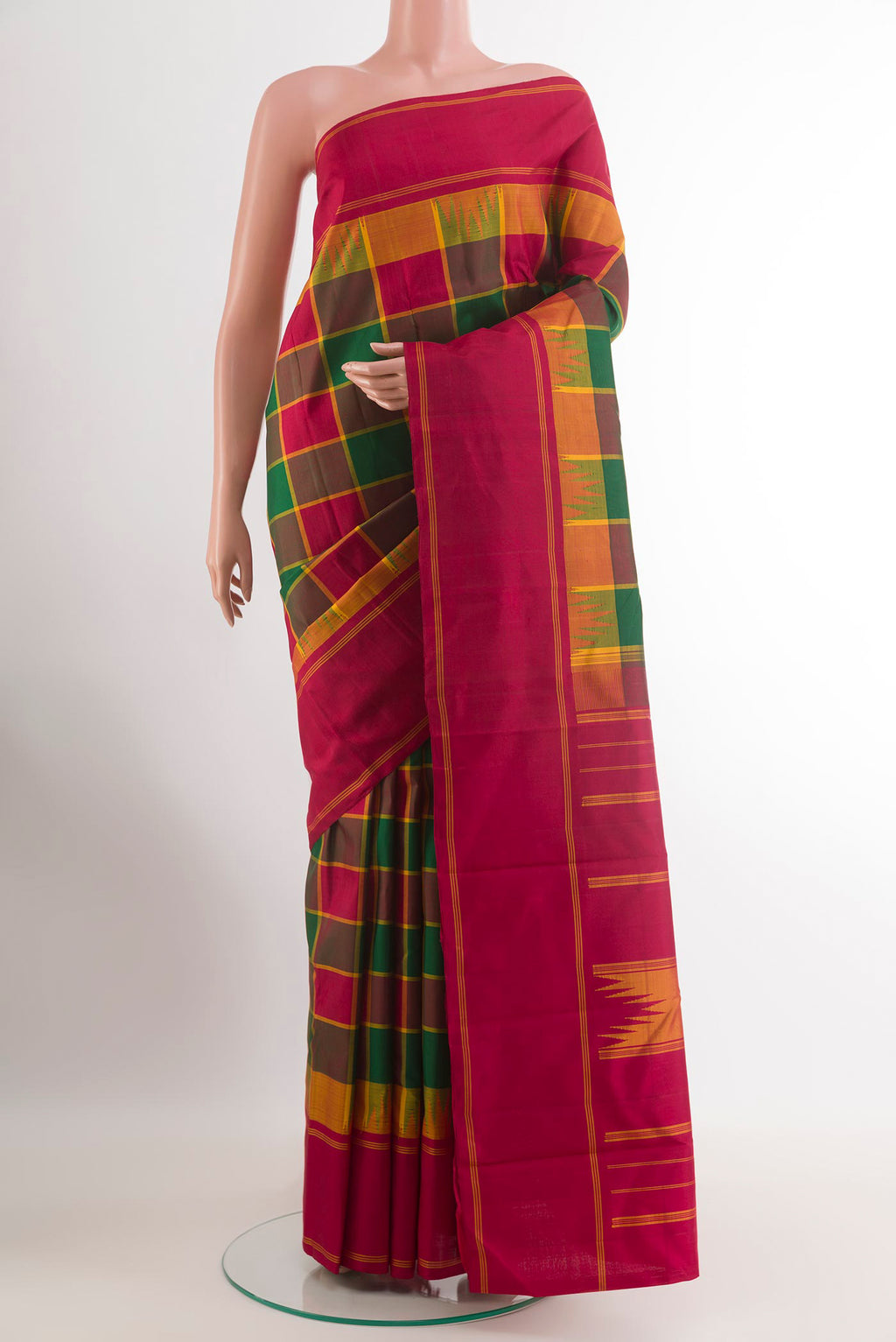 Multi Color Kanjivaram Silk Saree with Checked design on the body and Plain Border.  displayed on a mannequin