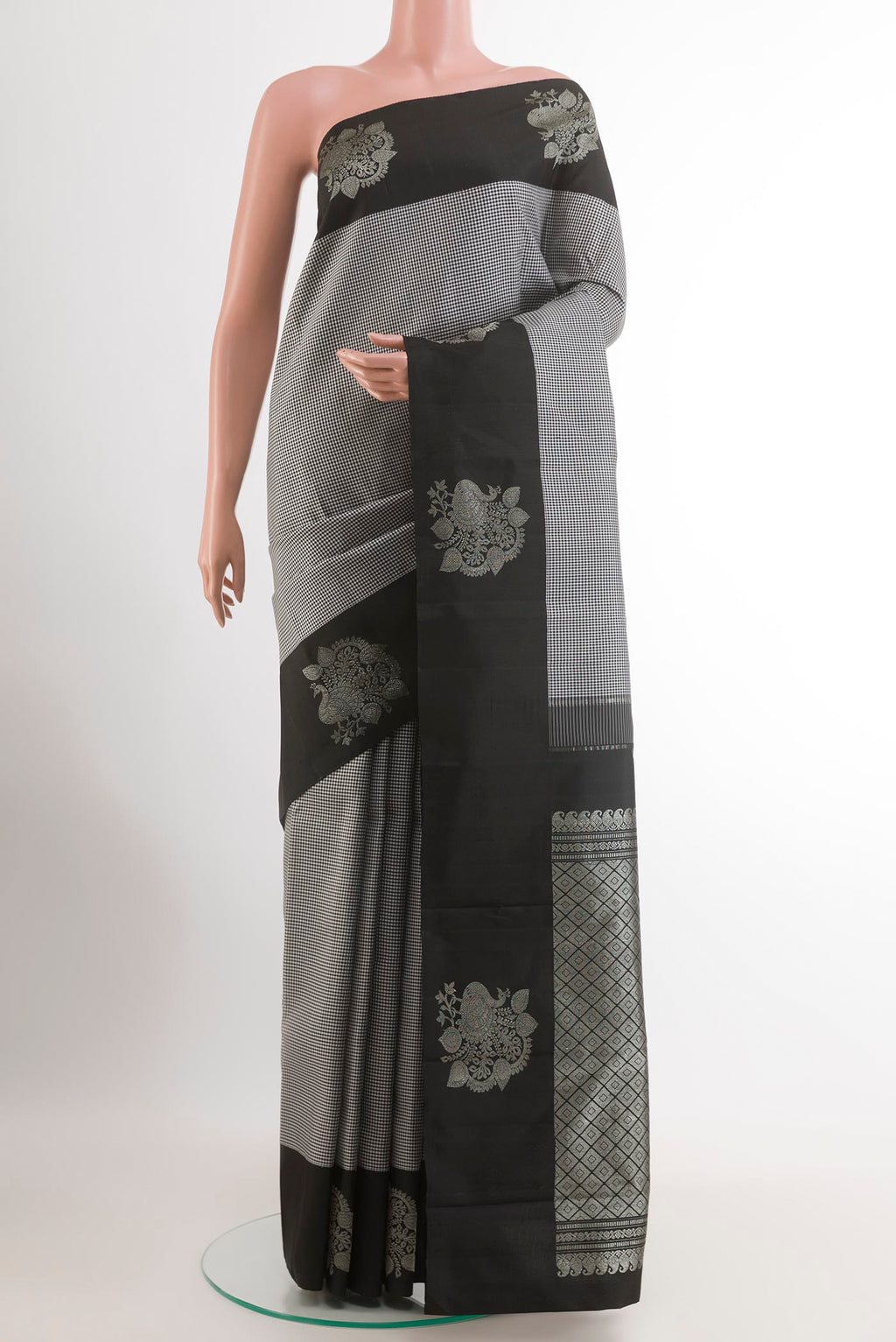 Multi Color Kanjivaram Silk Saree with Checked design on the body and Zari Border.  displayed on a mannequin