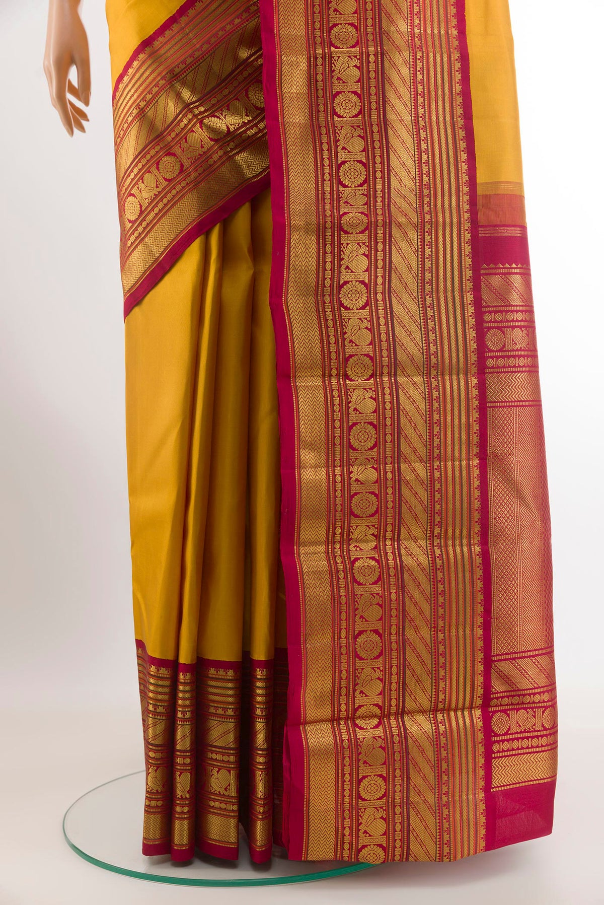 Pleats and pallu of Mustard Kanjivaram Silk Saree with Plain Body and Zari Border. 