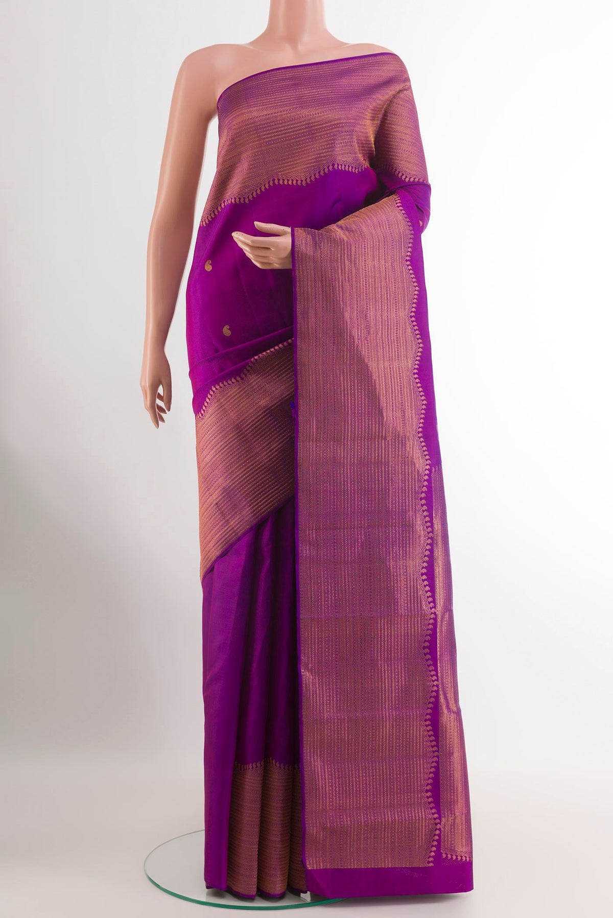 Purple Kanjivaram Silk Saree with Zari Butta on the body and Zari Border.  displayed on a mannequin