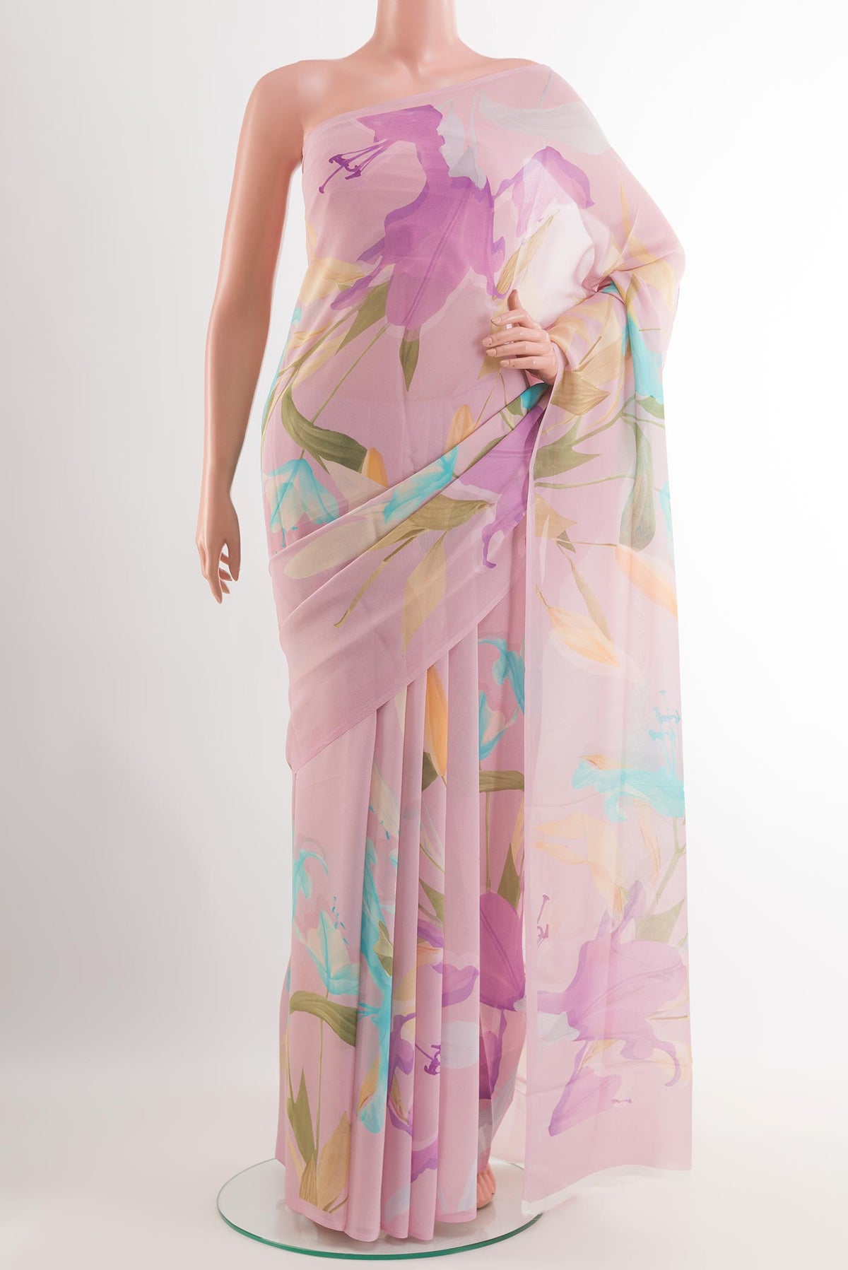 Pink Chiffon Saree with Printed design on the body and Plain Border.  displayed on a mannequin