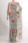 Green Chiffon Saree with Printed design on the body and Plain Border.  displayed on a mannequin