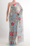 Blue Chiffon Saree with Printed design on the body and Plain Border.  displayed on a mannequin