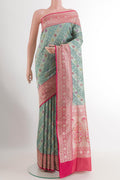 Grey Banarasi Silk Saree with Zari Brocade on the body and Zari Border.  displayed on a mannequin