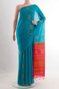 Blue Blended Kora Cotton Saree with Zari Butta on the body and Zari Border.  displayed on a mannequin