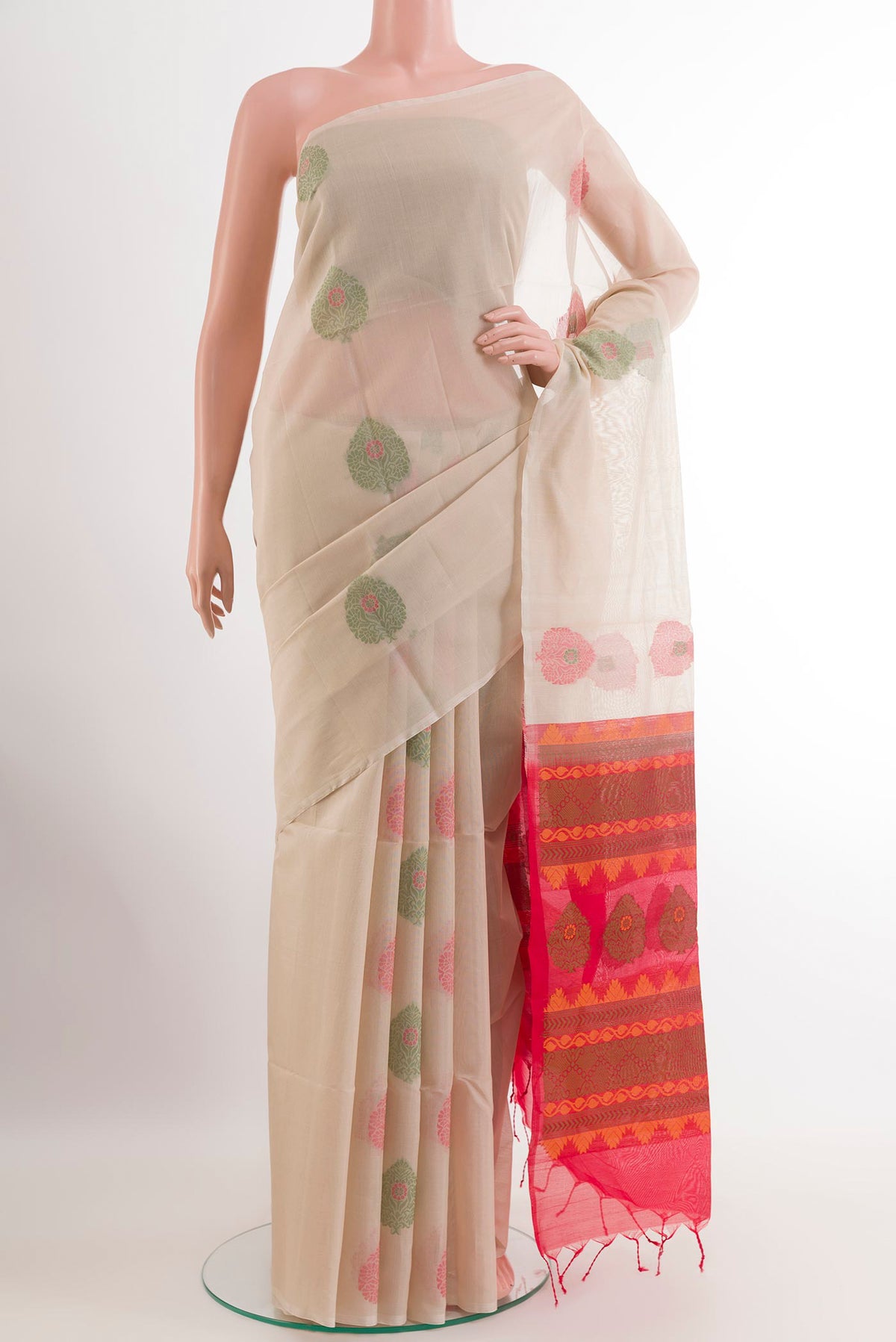 Cream Silk Cotton Saree with Zari Butta on the body and Without Border.  displayed on a mannequin