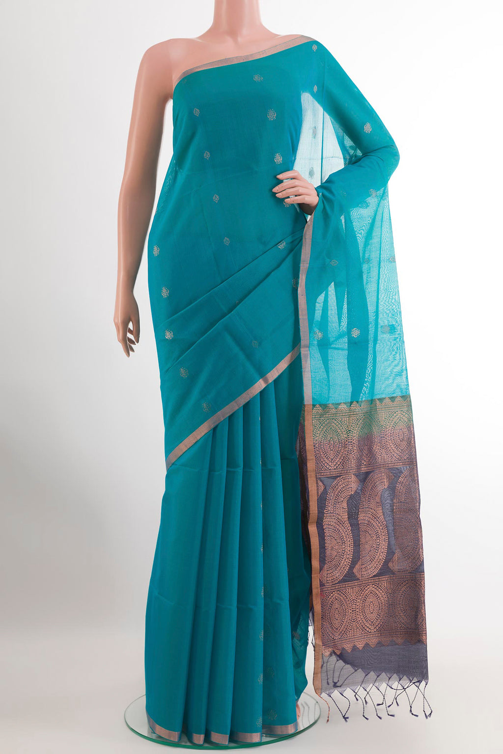 Blue Silk Cotton Saree with Zari Butta on the body and Zari Border.  displayed on a mannequin