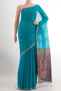 Blue Silk Cotton Saree with Zari Butta on the body and Zari Border.  displayed on a mannequin