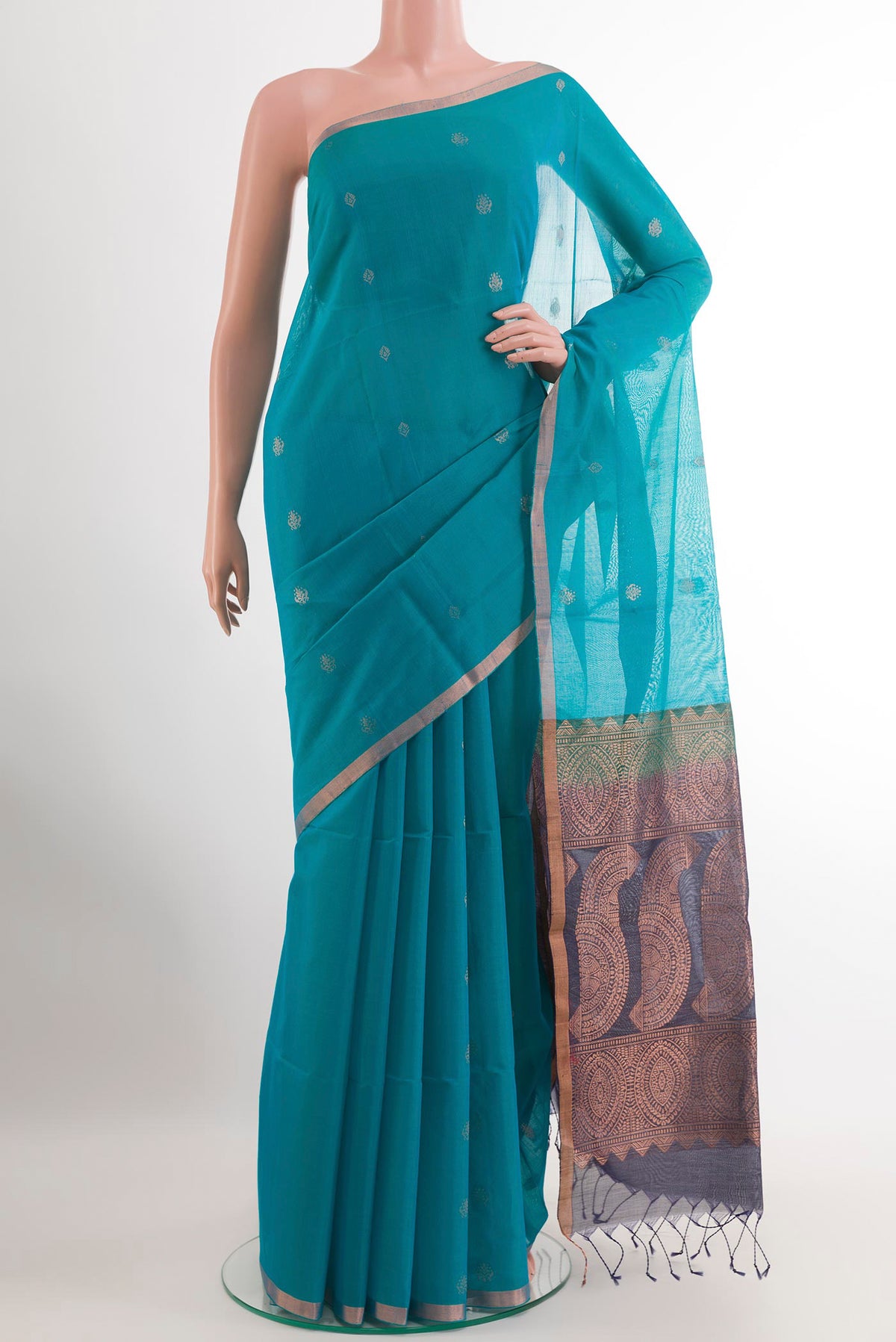 Blue Silk Cotton Saree with Zari Butta on the body and Zari Border.  displayed on a mannequin