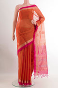 Orange Blended Kora Cotton Saree with Zari Butta on the body and Zari Border.  displayed on a mannequin