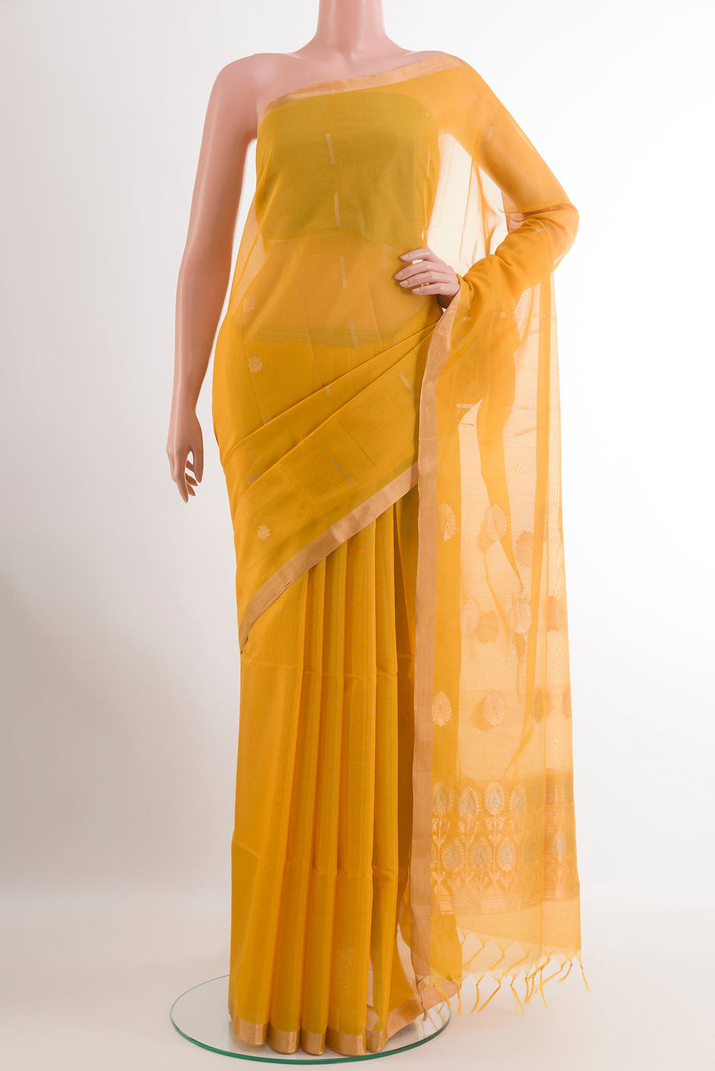 Yellow Silk Cotton Saree with Zari Butta on the body and Zari Border.  displayed on a mannequin