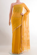 Yellow Silk Cotton Saree with Zari Butta on the body and Zari Border.  displayed on a mannequin