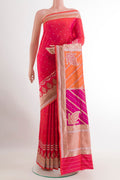 Pink with Orange Color Banarasi Silk Saree with Zari Butta on the body and Zari Border.  displayed on a mannequin