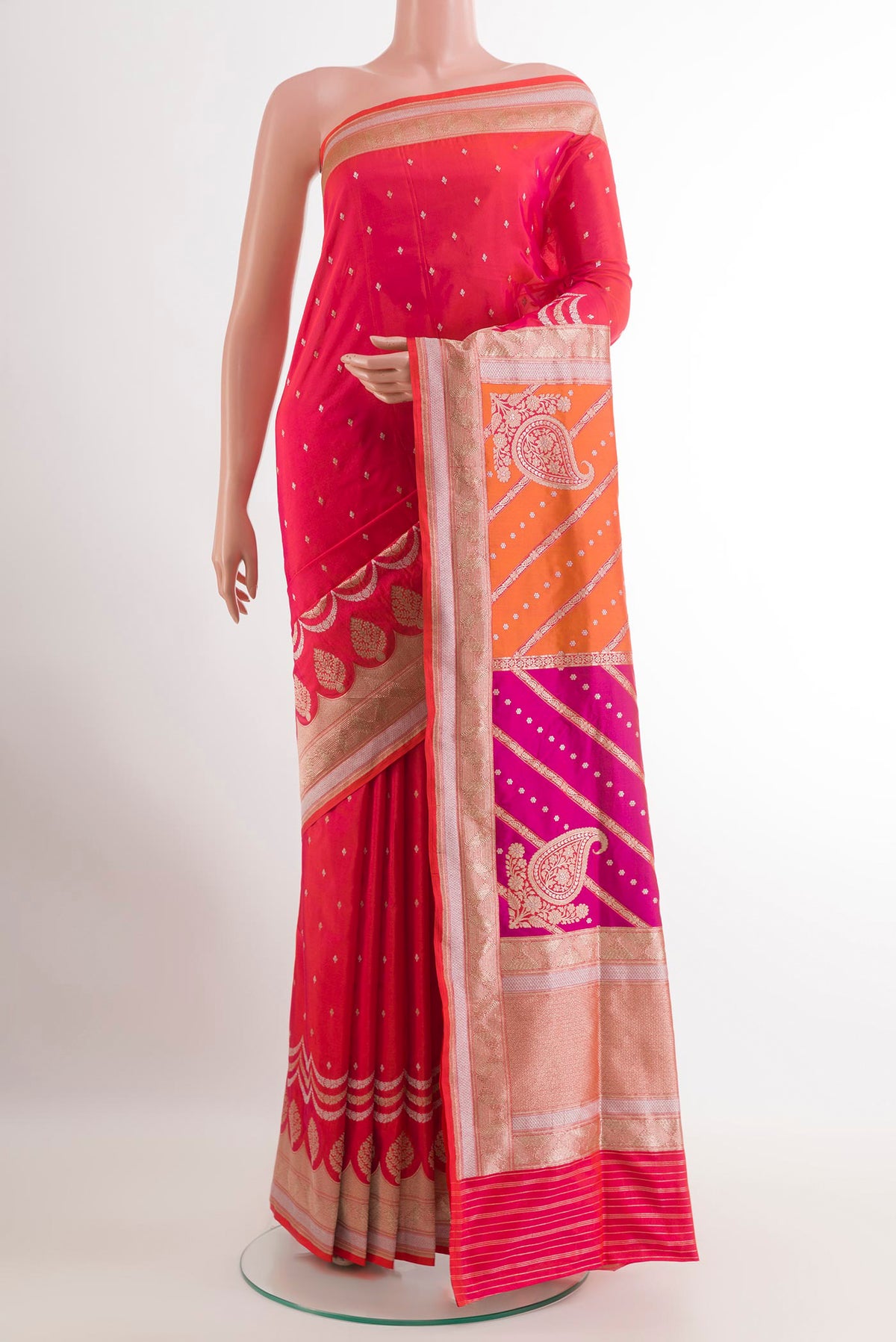 Pink with Orange Color Banarasi Silk Saree with Zari Butta on the body and Zari Border.  displayed on a mannequin