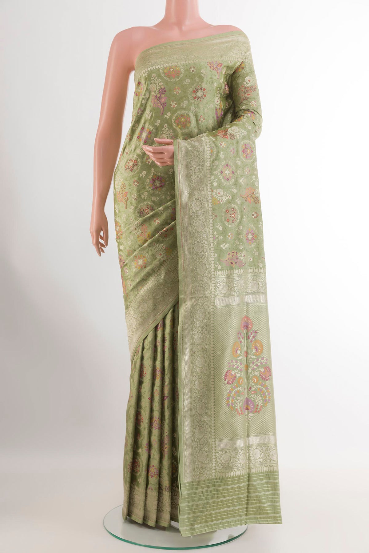 Sage Green Banarasi Silk Saree with Zari Brocade on the body and Zari Border.  displayed on a mannequin