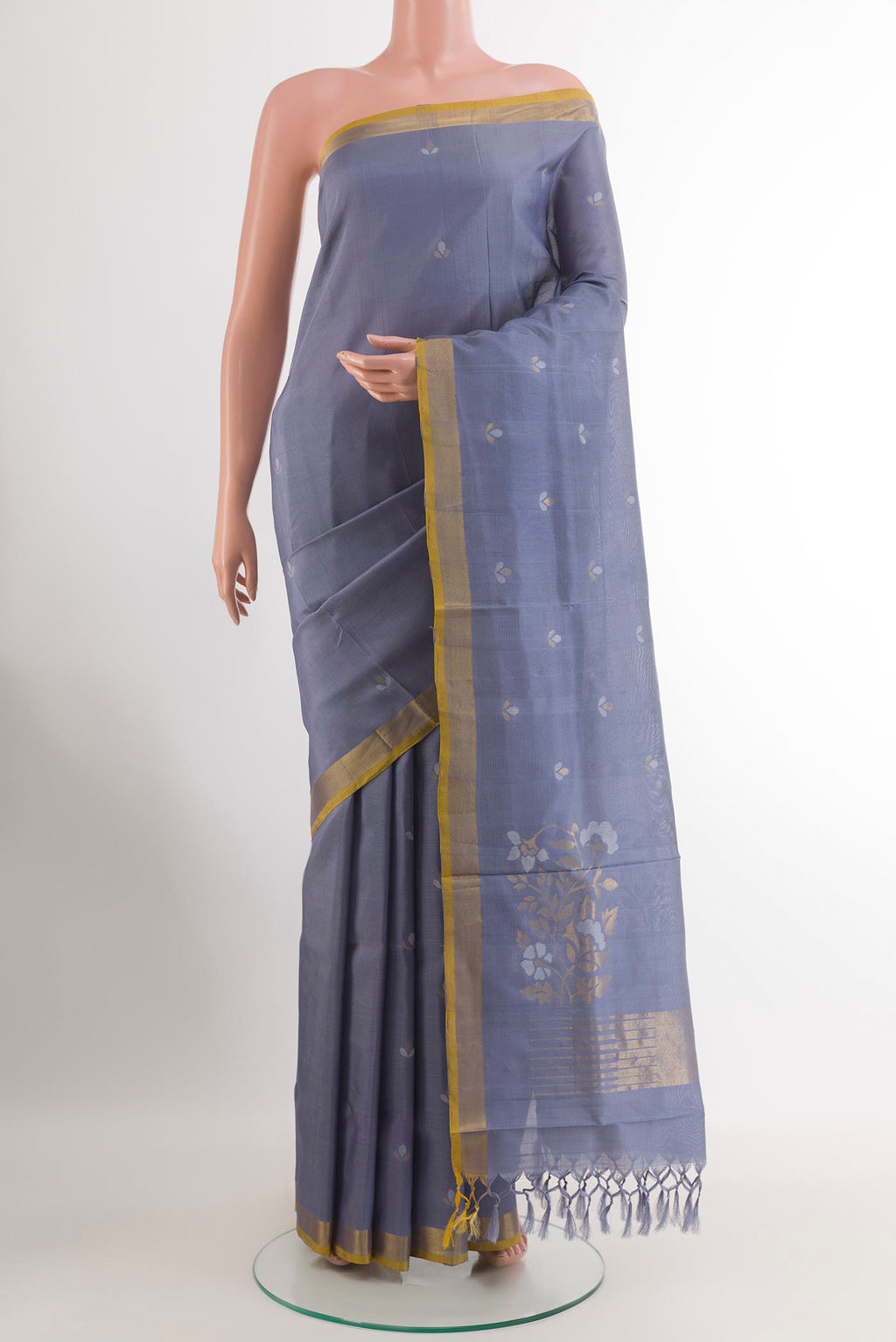 Blue Grey Uppada Silk Saree with Zari Butta on the body and Zari Border.  displayed on a mannequin