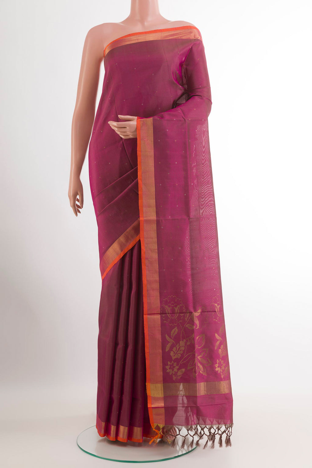 Magenta Uppada Silk Saree with Zari Butta on the body and Zari Border.  displayed on a mannequin
