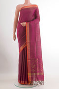 Magenta Uppada Silk Saree with Zari Butta on the body and Zari Border.  displayed on a mannequin