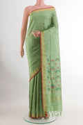 Sage Green Uppada Silk Saree with Zari Butta on the body and Zari Border.  displayed on a mannequin