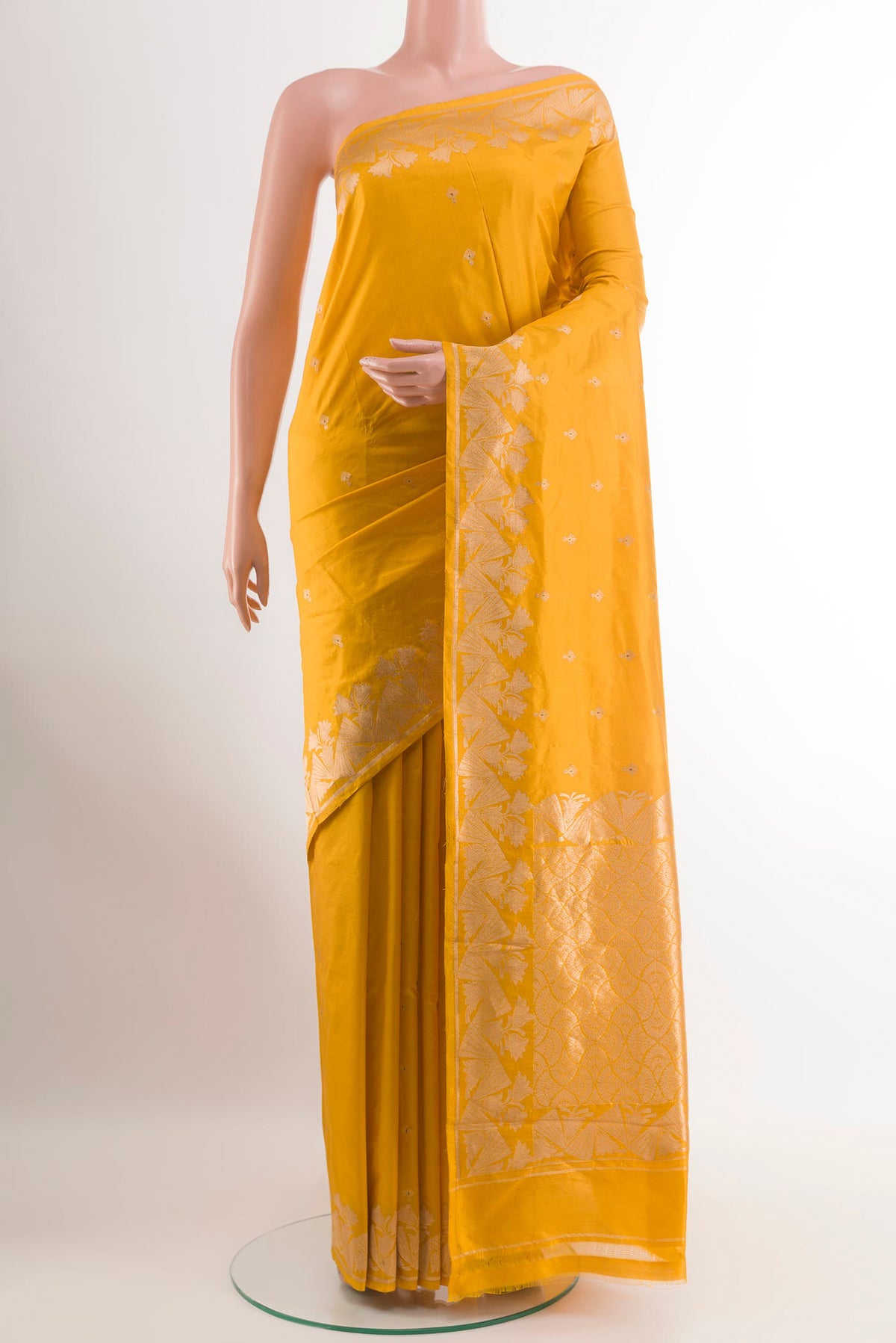 Yellow Banarasi Katan Silk Saree with Zari Butta on the body and Zari Border.  displayed on a mannequin