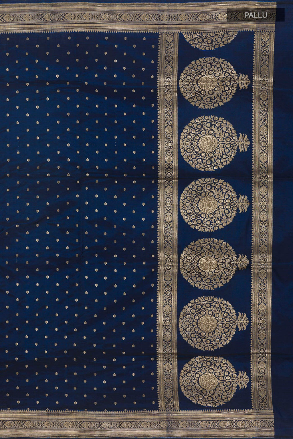 Close up image of the pallu of Blue Banarasi Silk Saree with Zari Butta on the body and Zari Border. 