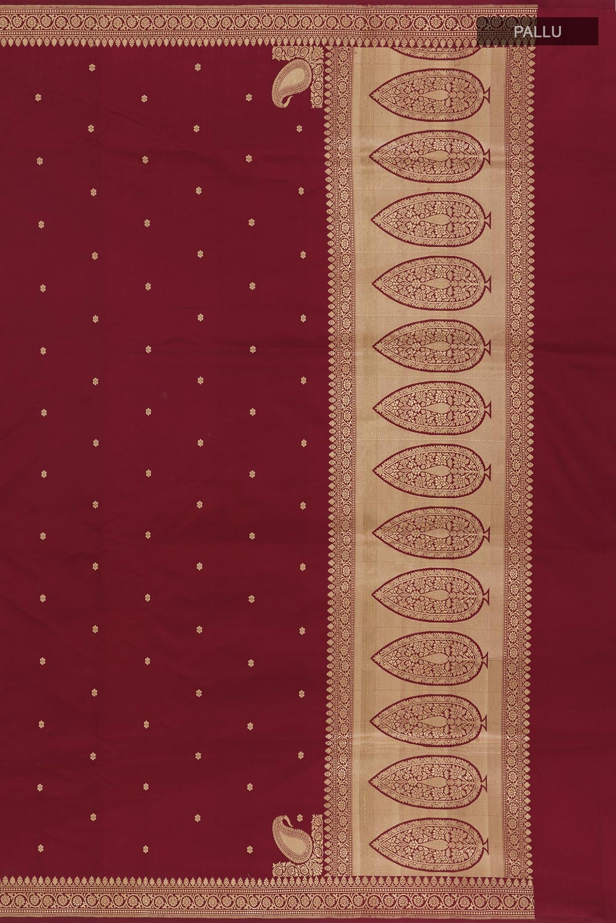 Close up image of the pallu of Maroon Banarasi Silk Saree with Zari Butta on the body and Zari Border. 