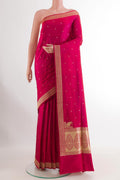 Pink Banarasi Silk Saree with Zari Butta on the body and Zari Border.  displayed on a mannequin