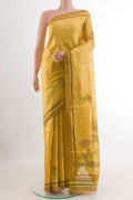 Yellow Tussar Saree with Printed design on the body and Printed Border.  displayed on a mannequin