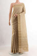 Beige Tussar Silk Saree with Zari Butta on the body and Zari Border.  displayed on a mannequin