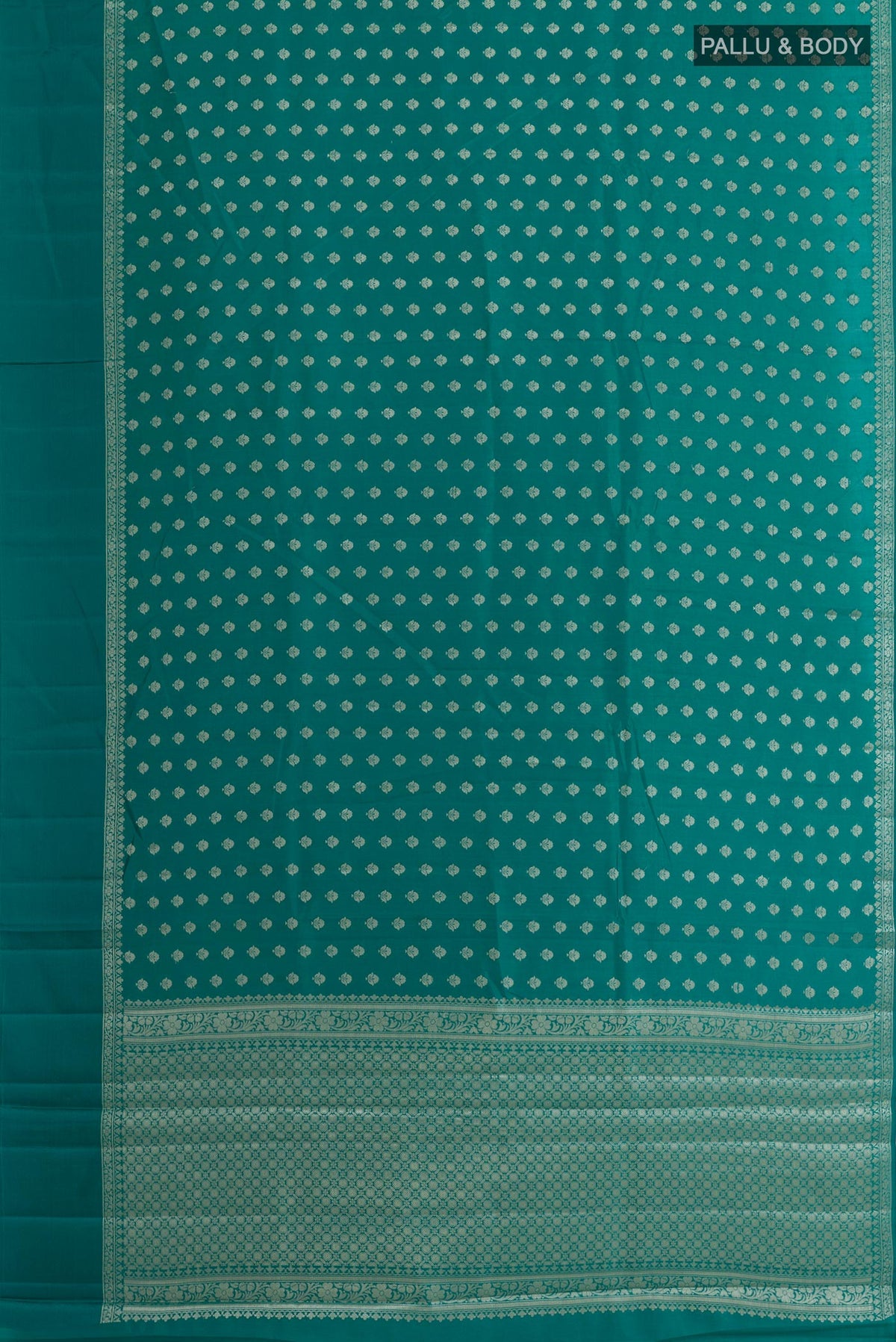Flat view of Sea Green Tussar Silk Saree with Zari Butta on the body and Zari Border. 