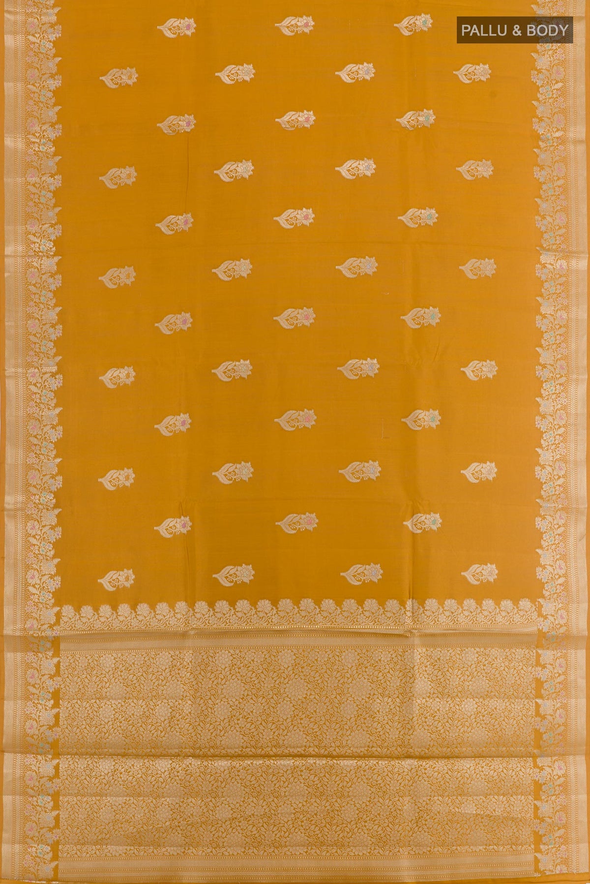 Flat view of Mustard Tussar Silk Saree with Zari Butta on the body and Zari Border. 
