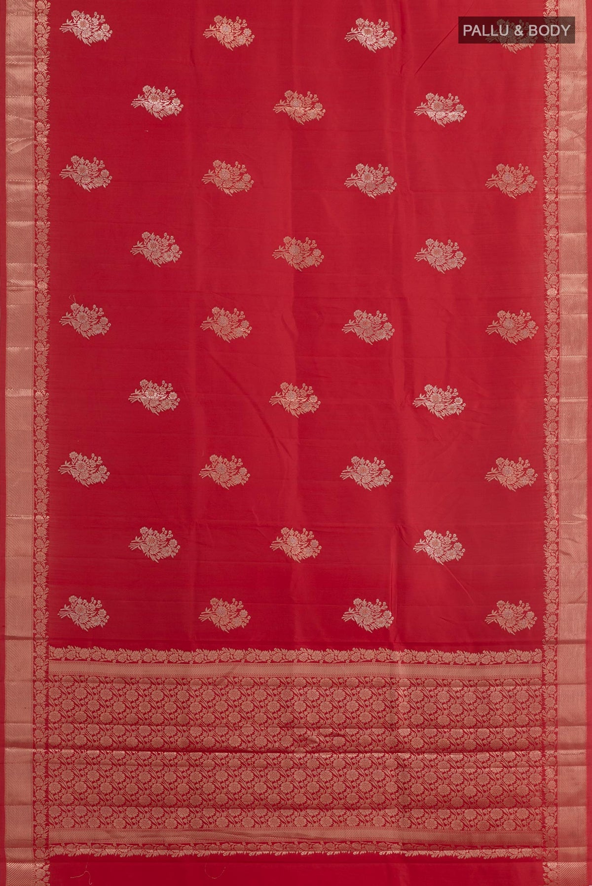 Flat view of Red Tussar Silk Saree with Zari Butta on the body and Zari Border. 