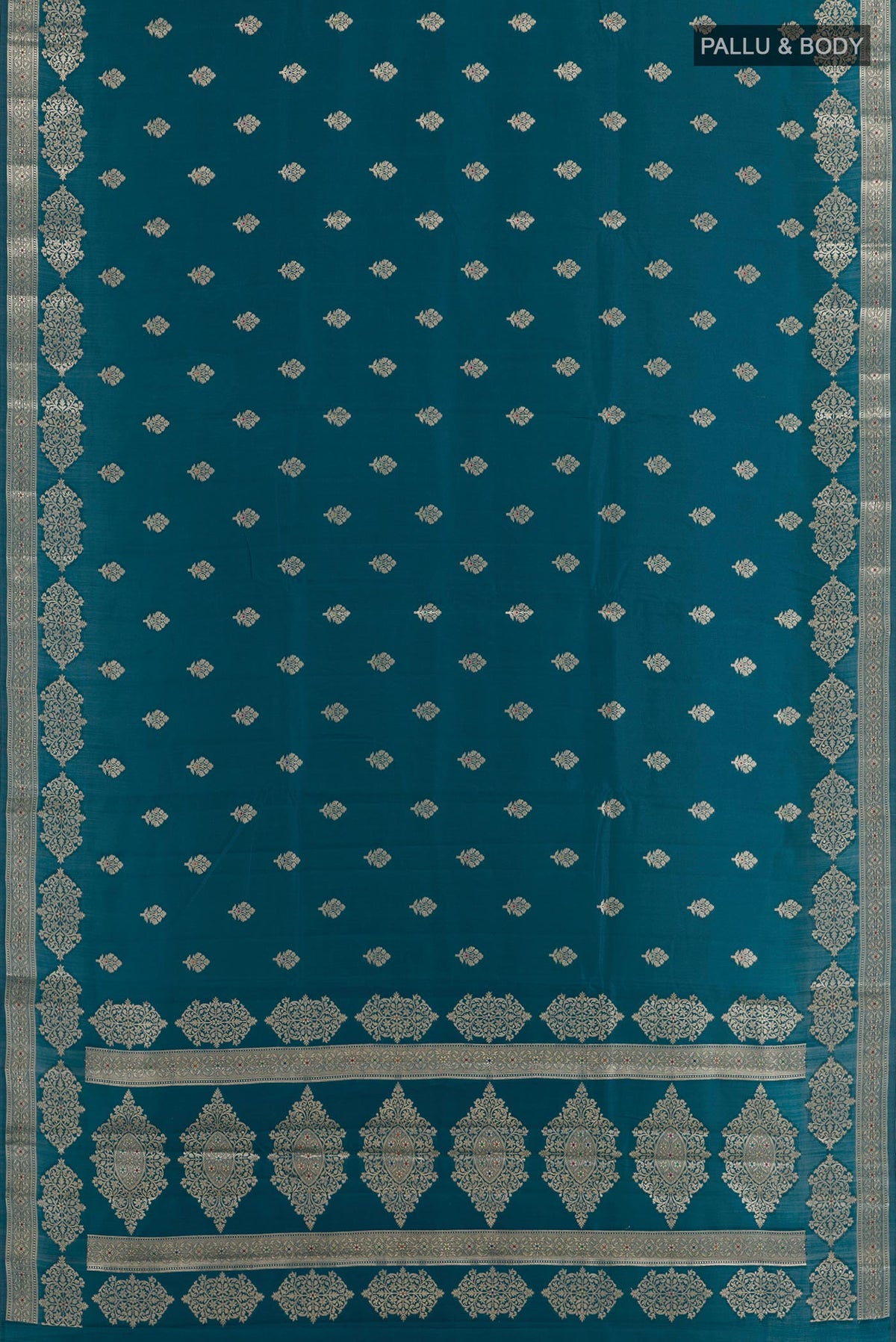 Flat view of Blue Tussar Silk Saree with Zari Butta on the body and Zari Border. 
