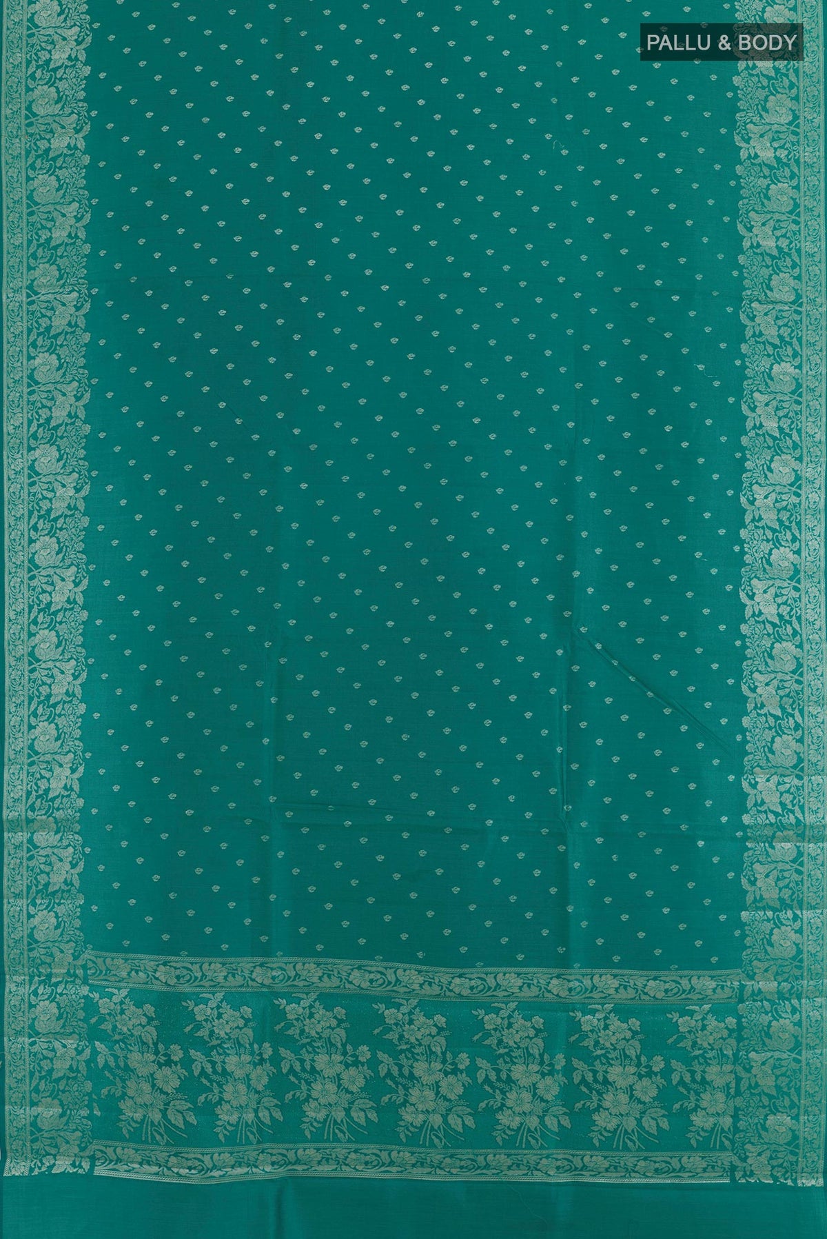 Flat view of Sea Green Tussar Silk Saree with Zari Butta on the body and Zari Border. 