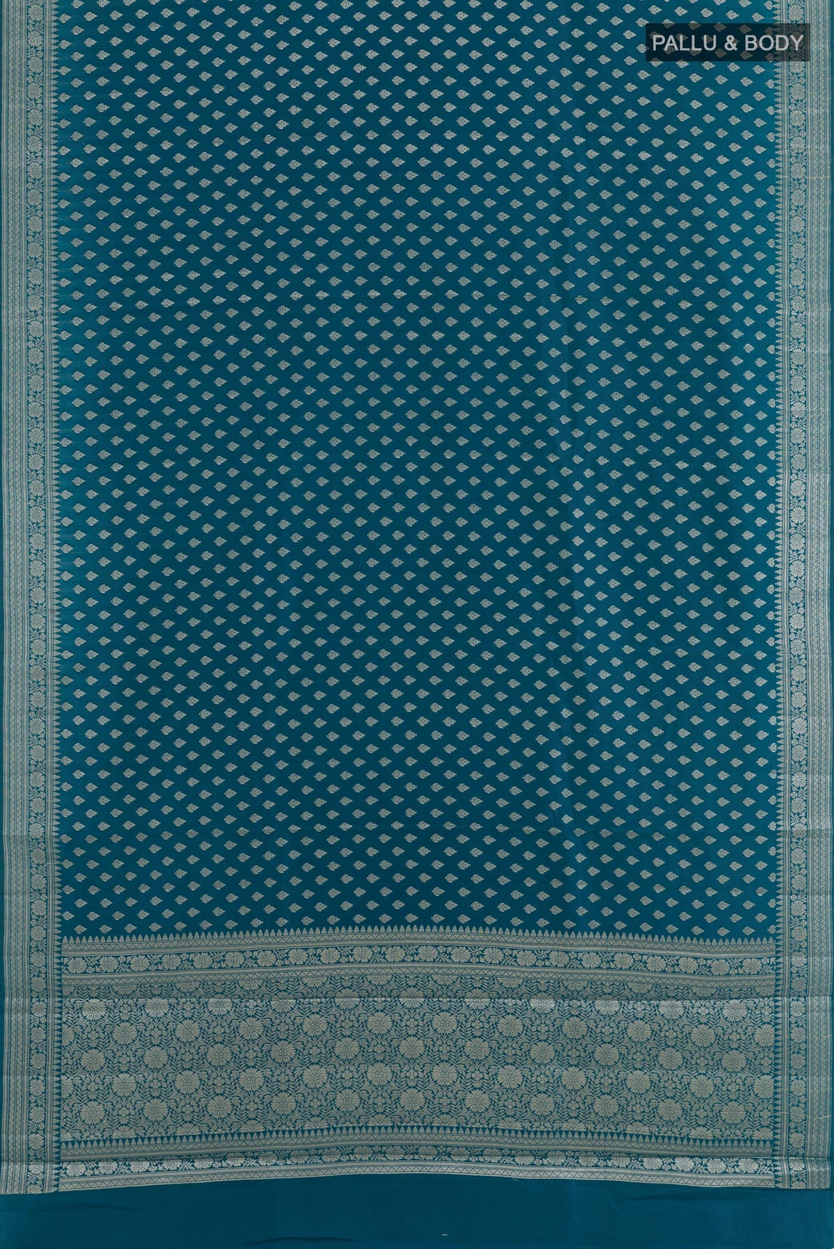 Flat view of Blue Tussar Silk Saree with Zari Butta on the body and Zari Border. 