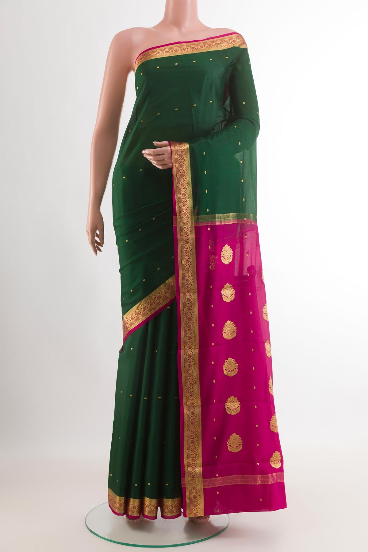 Green Mysore Silk Saree with Zari Butta on the body and Zari Border.  displayed on a mannequin