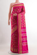 Pink Pochampally Silk Saree with Ikat design on the body and Zari Border.  displayed on a mannequin