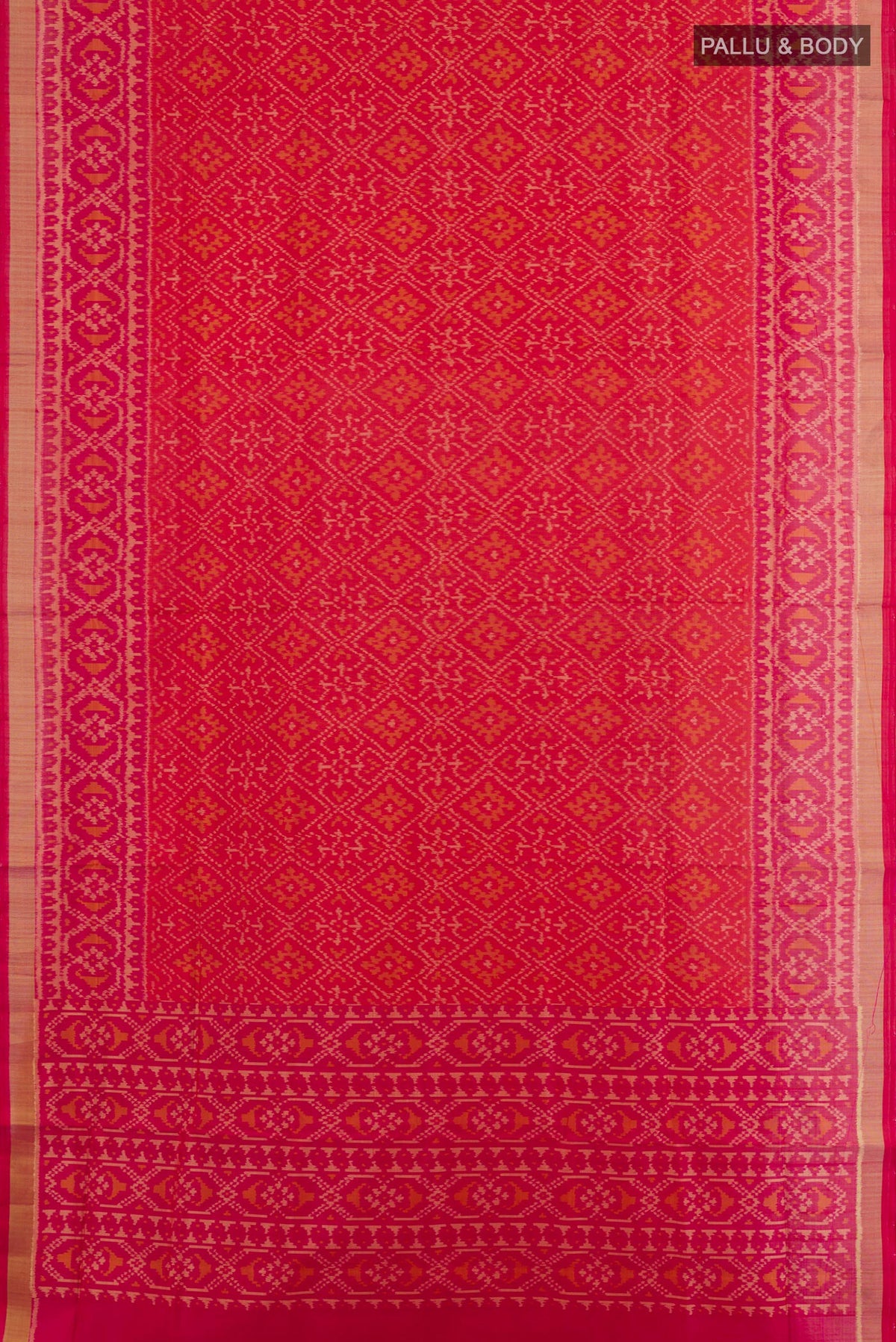 Flat view of Red Rajkot Patola Silk Saree with Ikat design on the body and Zari Border. 